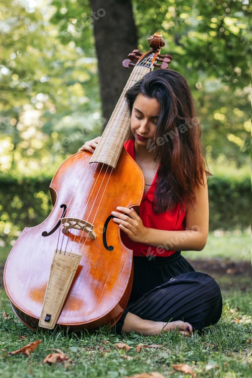 Preview: Woman with cello in a park