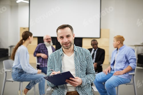 Preview: Mature Psychologist Posing in Group Therapy
