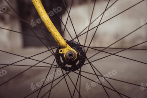 Preview: Isolated image of the wheel of a yellow bicycle