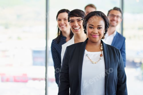 Preview: Portrait of a team of diverse colleagues standing together in a line at the office