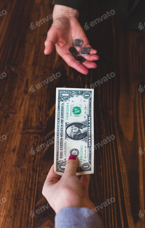 Preview: Two hands holding out money, training a dollar for four quarters coins