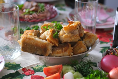 Preview: Ukrainian Easter festive dishes. Festive table setting. Bright colored eggs, cake Paska