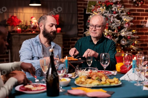Preview: Diverse family having christmas festive dinner