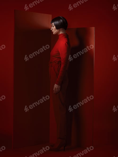 Preview: Future fashion, art and woman with red makeup and unique studio background with retro cosmetics. Fu