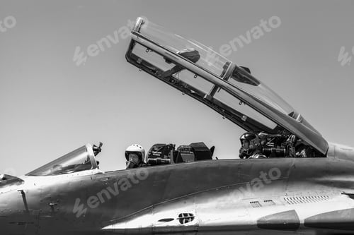 Preview: Gray scale shot of two males sitting in a Russian Air Force vehicle