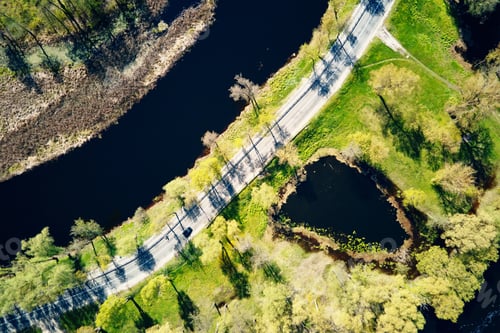 Preview: Car moving on the road in europe small town, aerial view