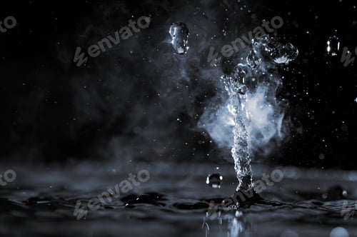 Preview: Boiling water splash with steam on black background closeup
