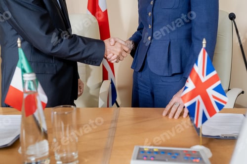 Preview: Contemporary politicians in formalwear shaking hands