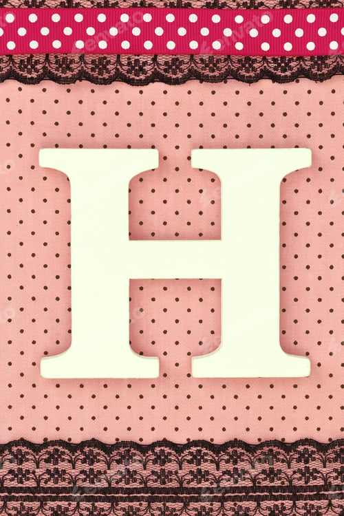 Preview: Wooden letter H on polka dots background