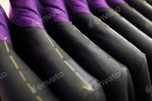Preview: Full frame shot of suits in clothing store