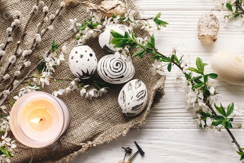 Preview: stylish painted easter egg black and white colors at rustic wooden background