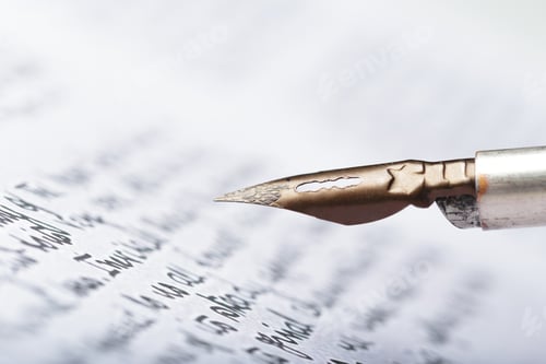 Preview: Close view of a fountain pen tip on written paper with ink strokes during a writing session