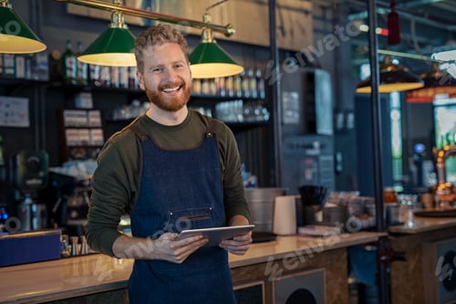 Preview: Smiling Waiter ready to take order at pub