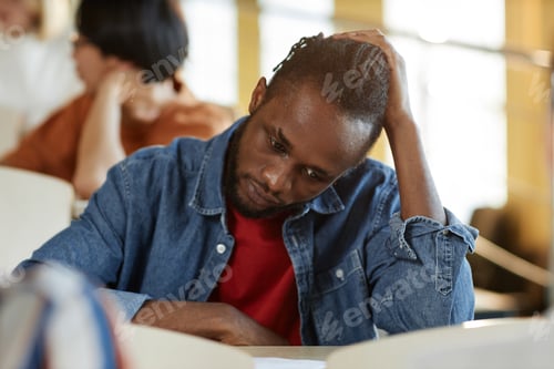 Preview: Stressed student writing exam at college
