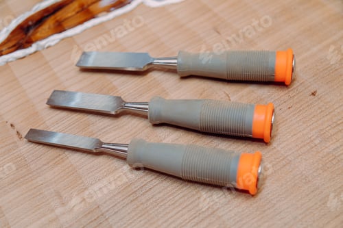 Preview: Set of chisels on wooden table