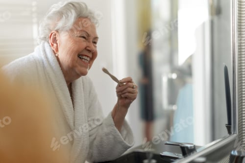 Preview: Senior woman cleaning her teeth with wooden brush in bathroom, sustainable lifestyle.