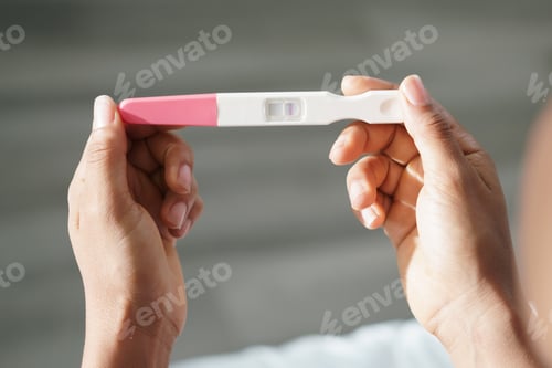 Preview: Woman Holding Negative Pregnancy Test Kit