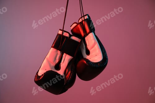 Preview: Boxing gloves are illuminated with red light