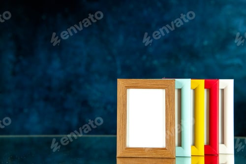 Preview: front view different picture frames with colored corners on dark-blue background photo portrait