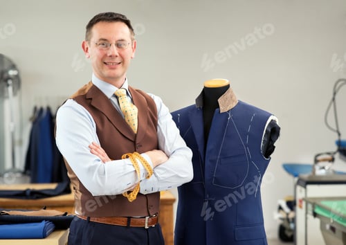 Preview: Smiling tailor in his workshop