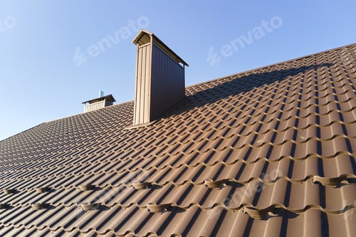 Preview: Closeup snow guard for safety in winter on house roof top covered with steel shingles. Tiled
