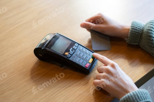 Preview: Person Using Credit Card and enter the password on bank wireless terminal Reader