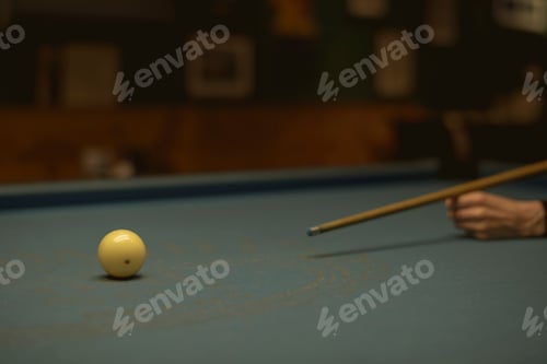 Preview: Woman playing pool at a bar