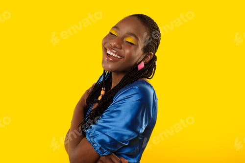 Preview: Black Female Laughing Out Loud Having Fun Over Yellow Background