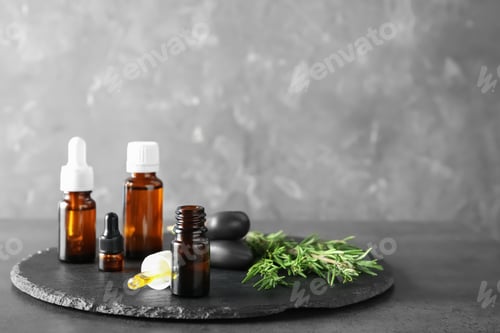 Preview: Spa composition with fresh rosemary oil on table