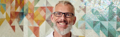 Preview: joyful middle aged man in white robe in sauna, spa and wellness concept, marble hammam, banner