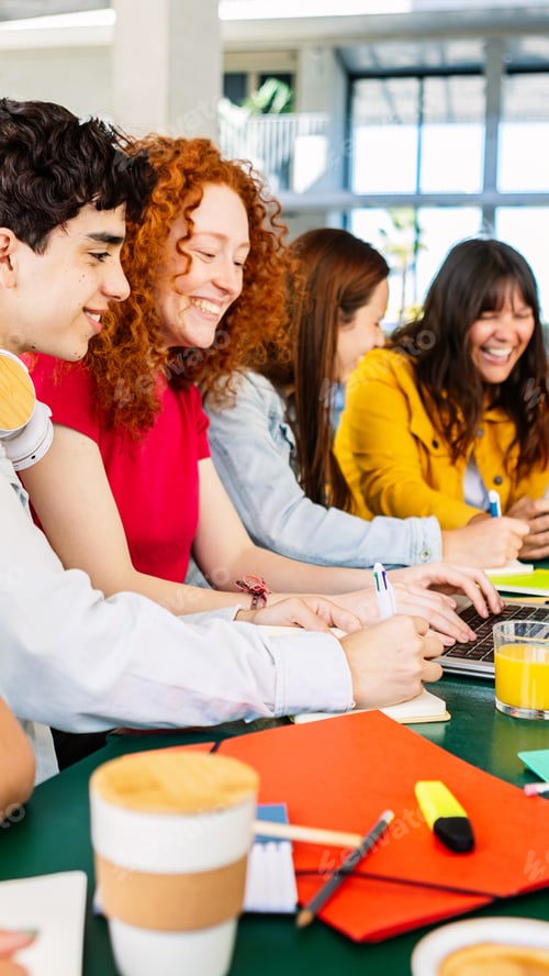 Preview: Young group of college friends studying together sitting on table at campus