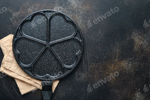 Preview: Empty frying pan black, skillet with stone nonstick coating for baking pancakes in shape of breakfas