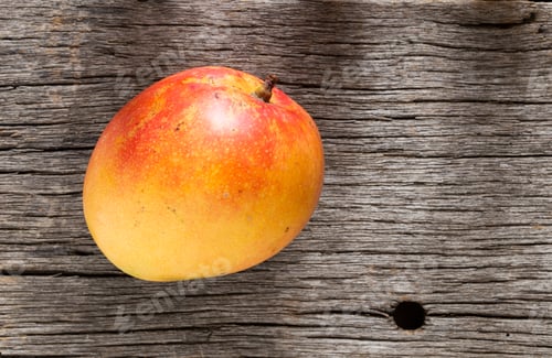 Preview: mango fruit on old wooden background, top view