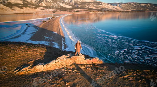 Preview: A young woman is traveling on the frozen Lake Baikal.