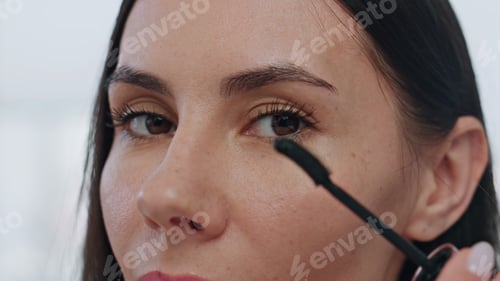 Preview: Confident model painting lushes home pov video. Brown eyed lady preparing makeup
