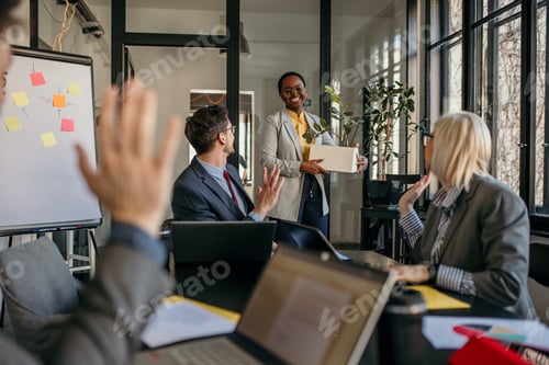 Preview: Happy employee leaving office with personal belongings after resignation