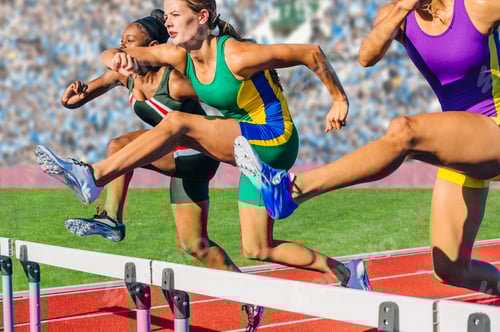 Preview: Runners jumping over hurdle on track