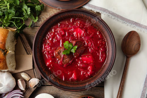Preview: Stylish brown clay bowl with Ukrainian borsch served on wooden table, flat lay