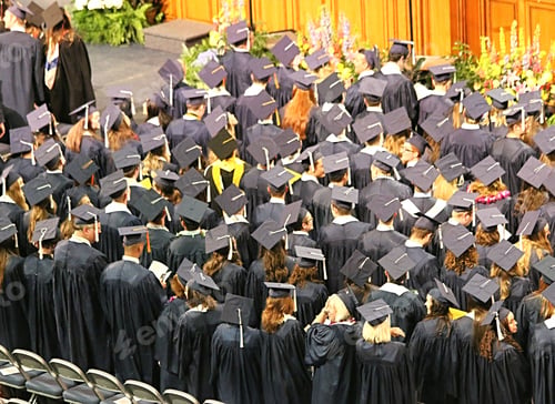 Preview: Crowd of graduates from behind at a university graduation ceremony.