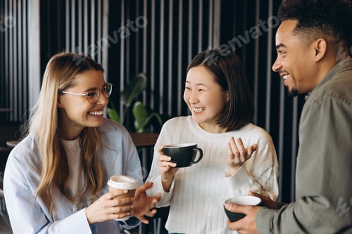 Preview: Colleagues Chatting During Coffee Break at Cafe