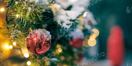 Preview: Christmas tree bulbs with yellow garlands covered snow, outdoor xmas tree with decorative red bulbs