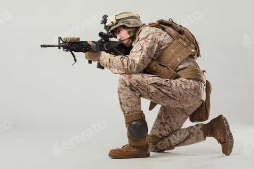 Preview: Soldier takes aim in tactical gear during training in indoor setting
