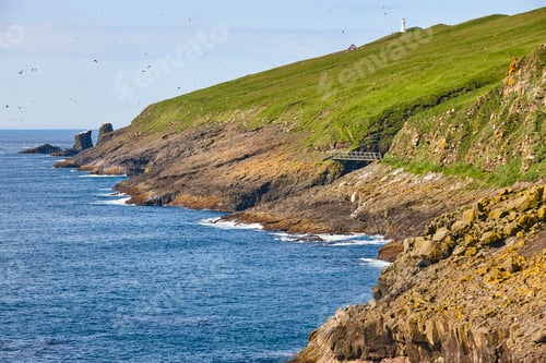 Preview: Mykines lighthouse and cliffs on Faroe islands. Hiking landmark