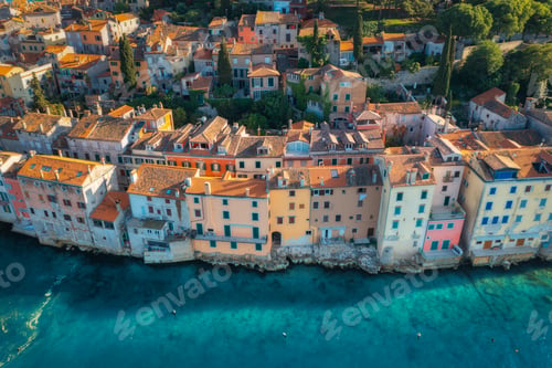 Preview: Aerial view of beautiful old houses with orange roofs at sunset
