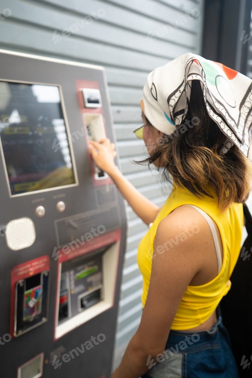 Preview: Unrecognizable young mexican woman paying her bus card. Integrated mobility.
