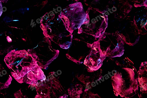Preview: top view of transparent ice cubes with purple lighting isolated on black