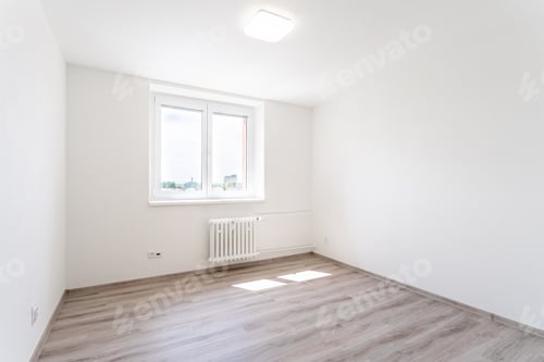 Preview: empty room with white walls and window in a new building, apartment for rent