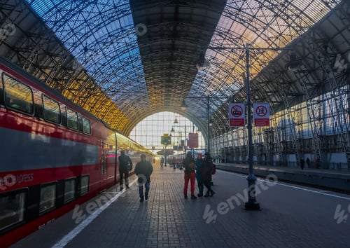 Preview: Railway platform at the station with standing red Aeroexpress train, passengers go and stand.