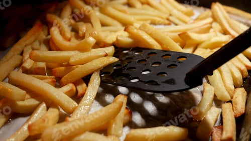 Preview: Closeup of chef cooking french fries potato in oven on frying pan. Fast food, healthy nutrition