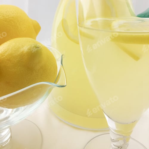 Preview: Refreshing Lemonade with Fresh Lemons and Glassware